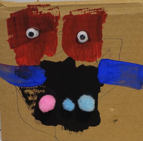 Abstract figure with blue arms and red eyes.