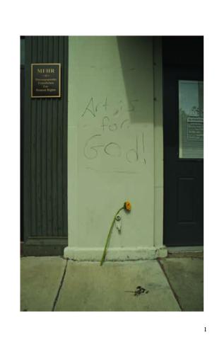 Photograph of wall with graffiti that says Art is for God!