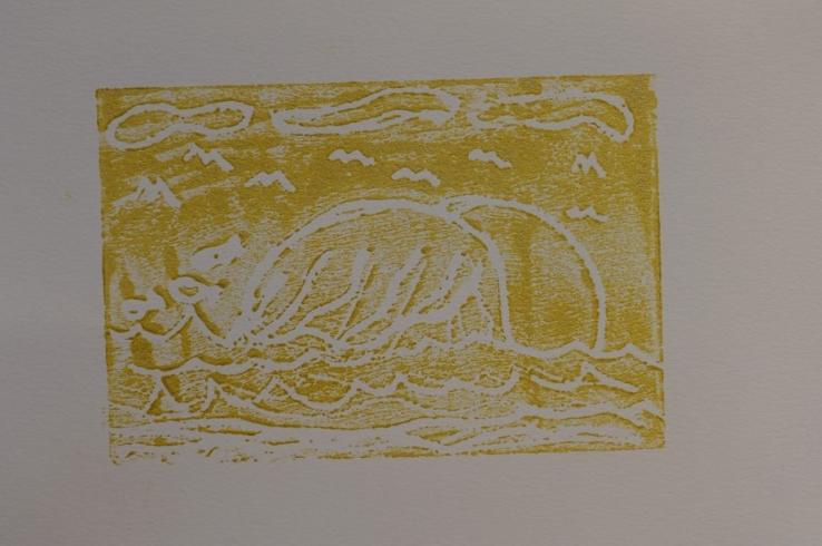 Yellow print with waves beneath the sky with birds.