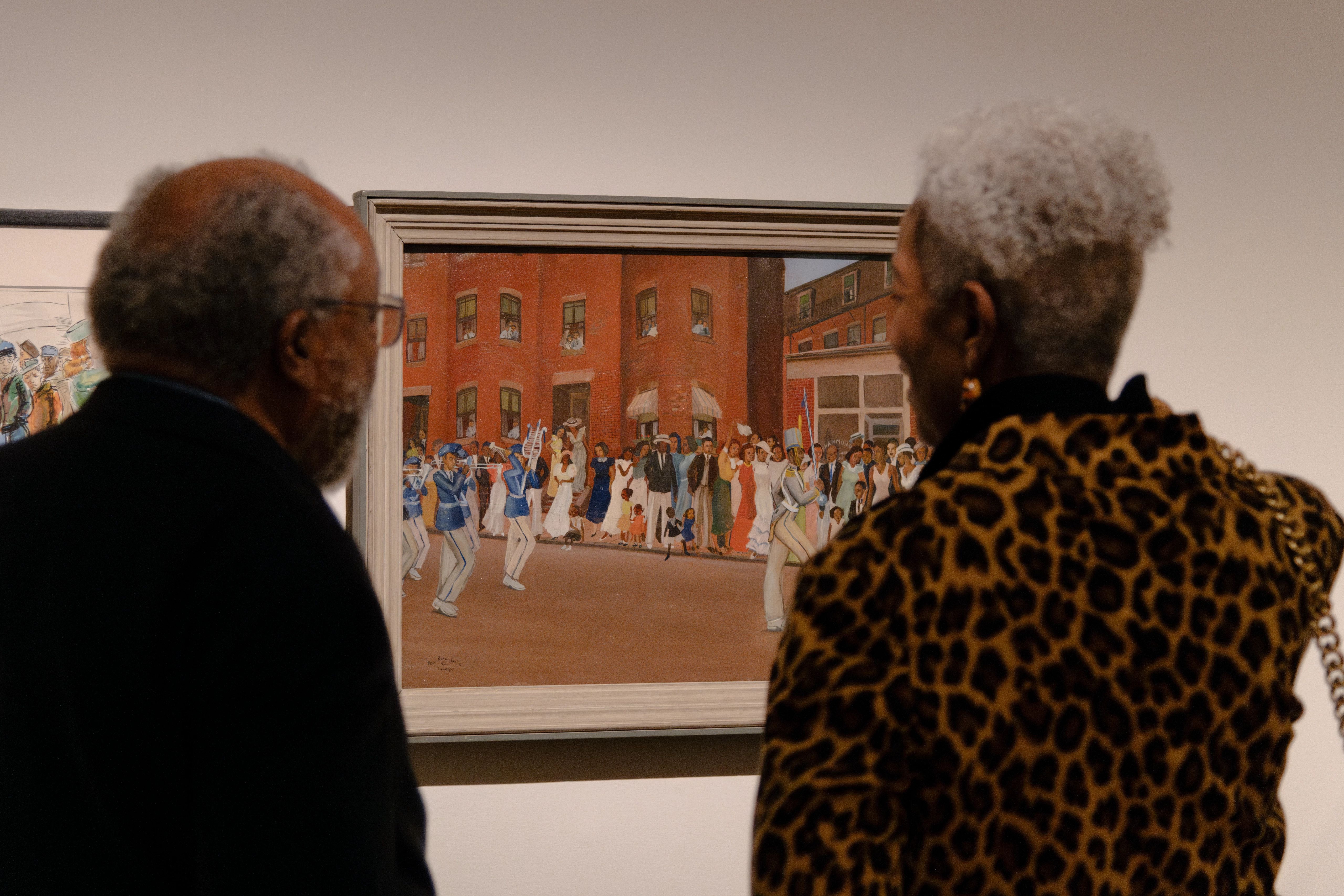 Two people looking at Allan Rohan Crite's Prade on Hammond Street