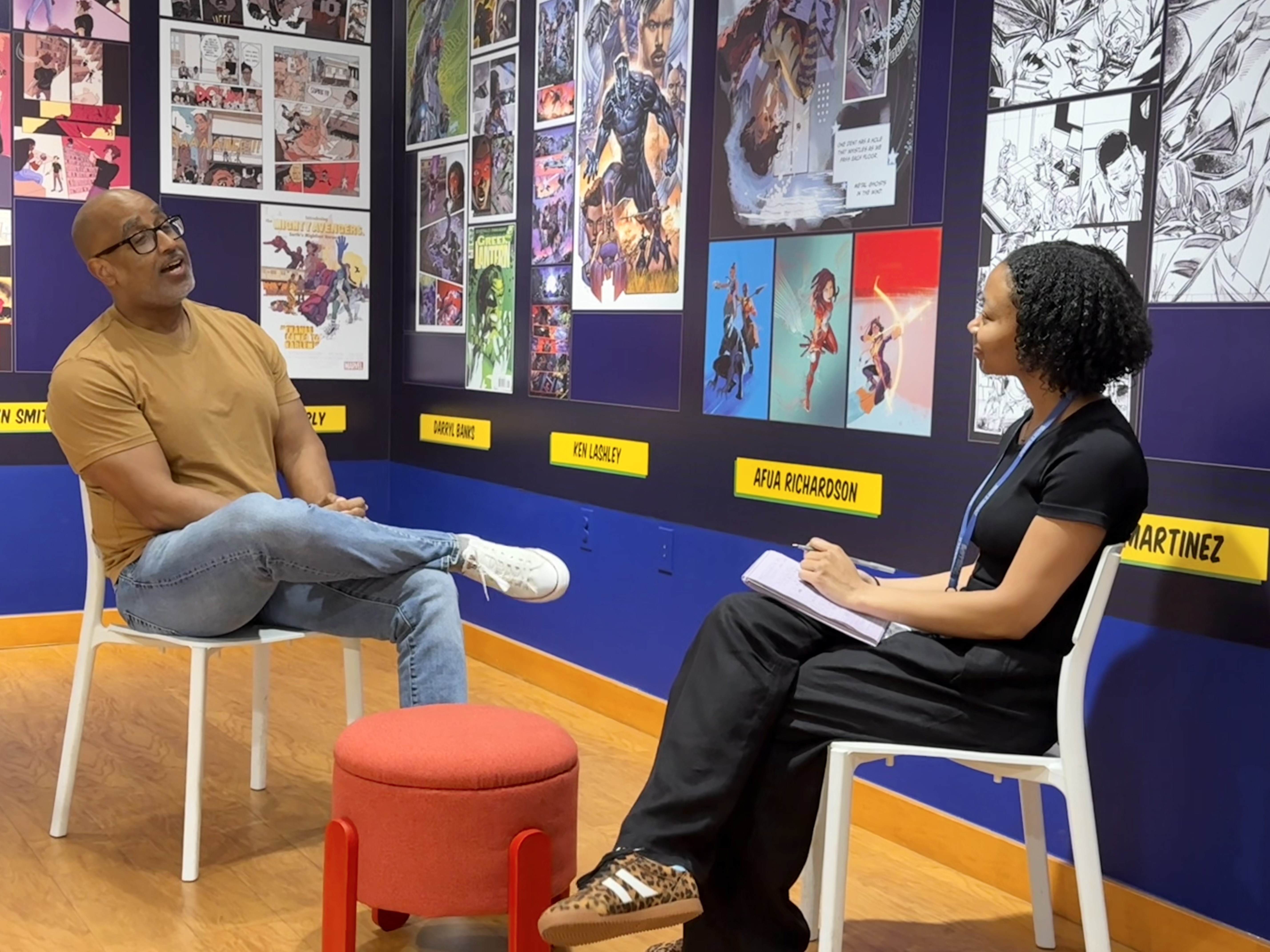 Shawn Martinbrough and Chantel Bennet chatting in the Brotherman to Batman exhibition