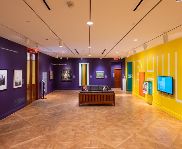 A room with colorful walls and a couch