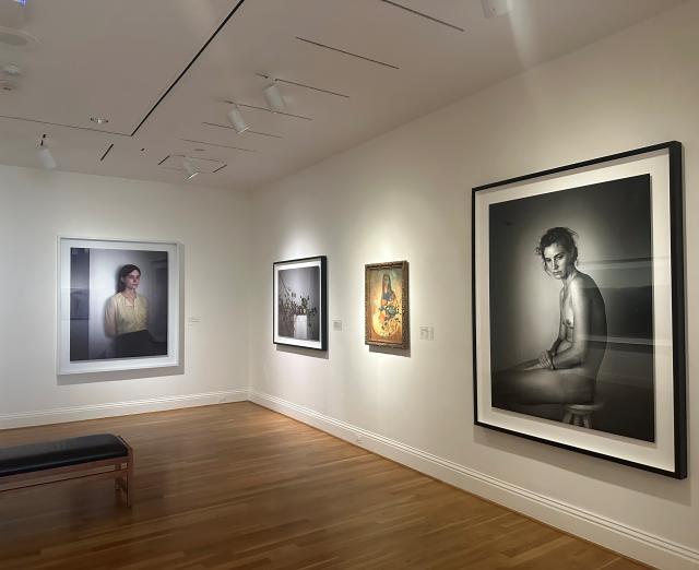 Installation photograph of Richard Learoyd and Odilon Redon artworks
