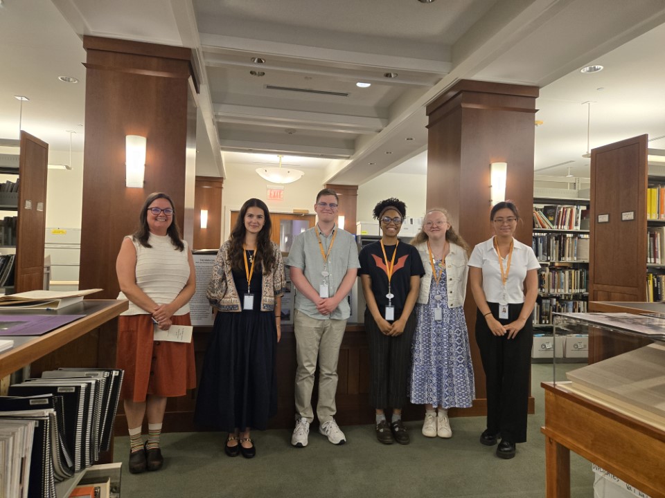Summer 2025 interns standing in the Phillips library