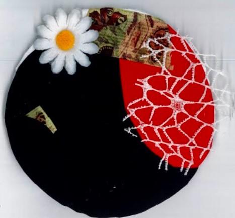 Circle with collage of half red material, half black, and a white flower.