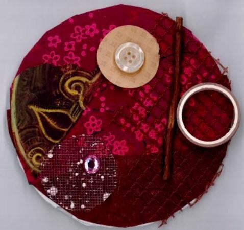 Circle with collage of red materials and circle-shaped items.