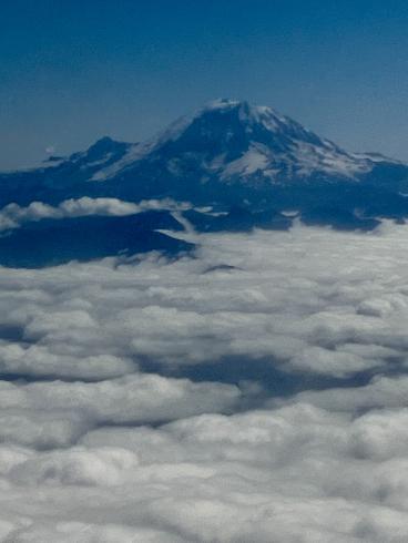Photograph of clouds and mountaintop