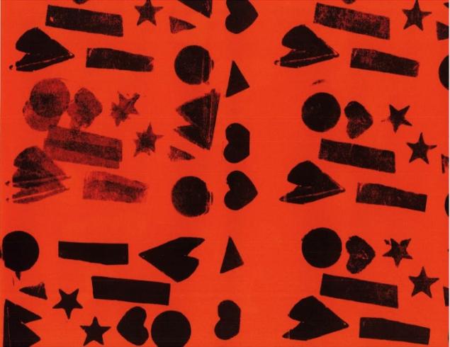 Black stamped pattern on bright orange paper.
