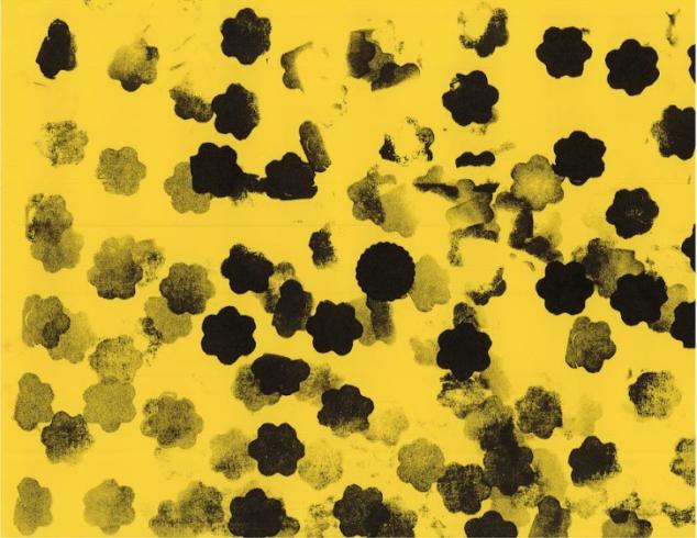 Pattern stamped on yellow paper.