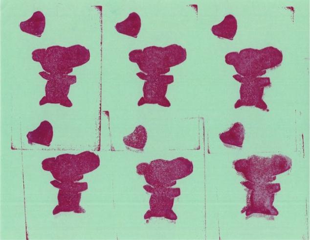 Pink bear pattern stamped on light green paper.