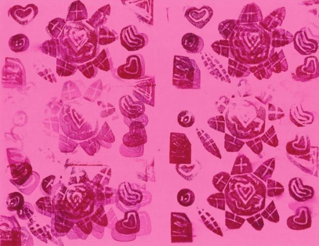 Red flower pattern stamped on pink paper.