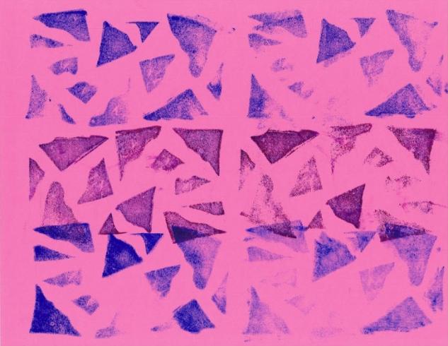 Triangle pattern stamped on pink paper.