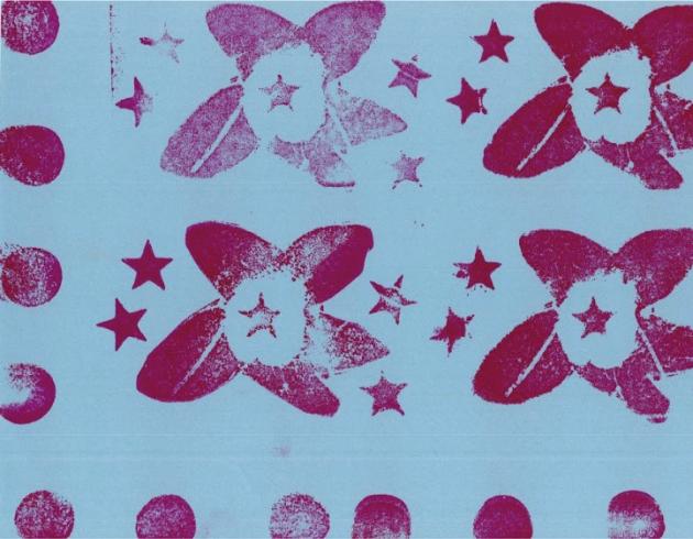Pink flower pattern stamped on blue paper.