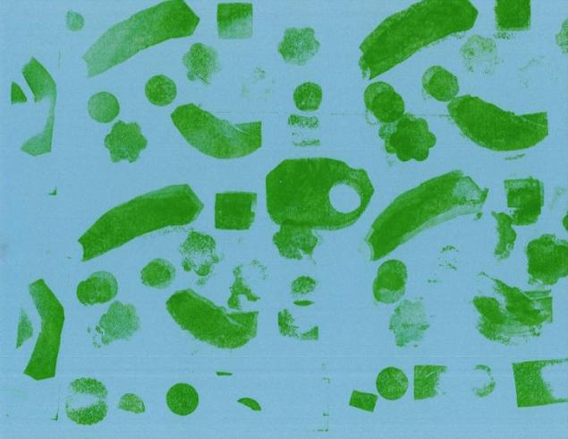 Green pattern stamped on blue paper.