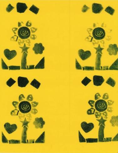 Flower pattern stamped on yellow paper.