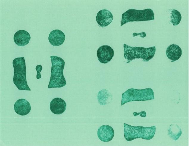 Green pattern stamped on green paper.