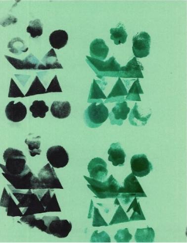 Pattern stamped on green paper.