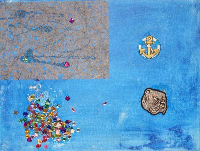 Blue painted canvas with stickers, paper, and gems.