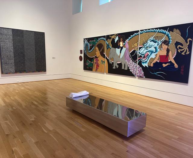 Installation view of artworks by Binion and Beynon on the wall, Soares in the middle of the gallery