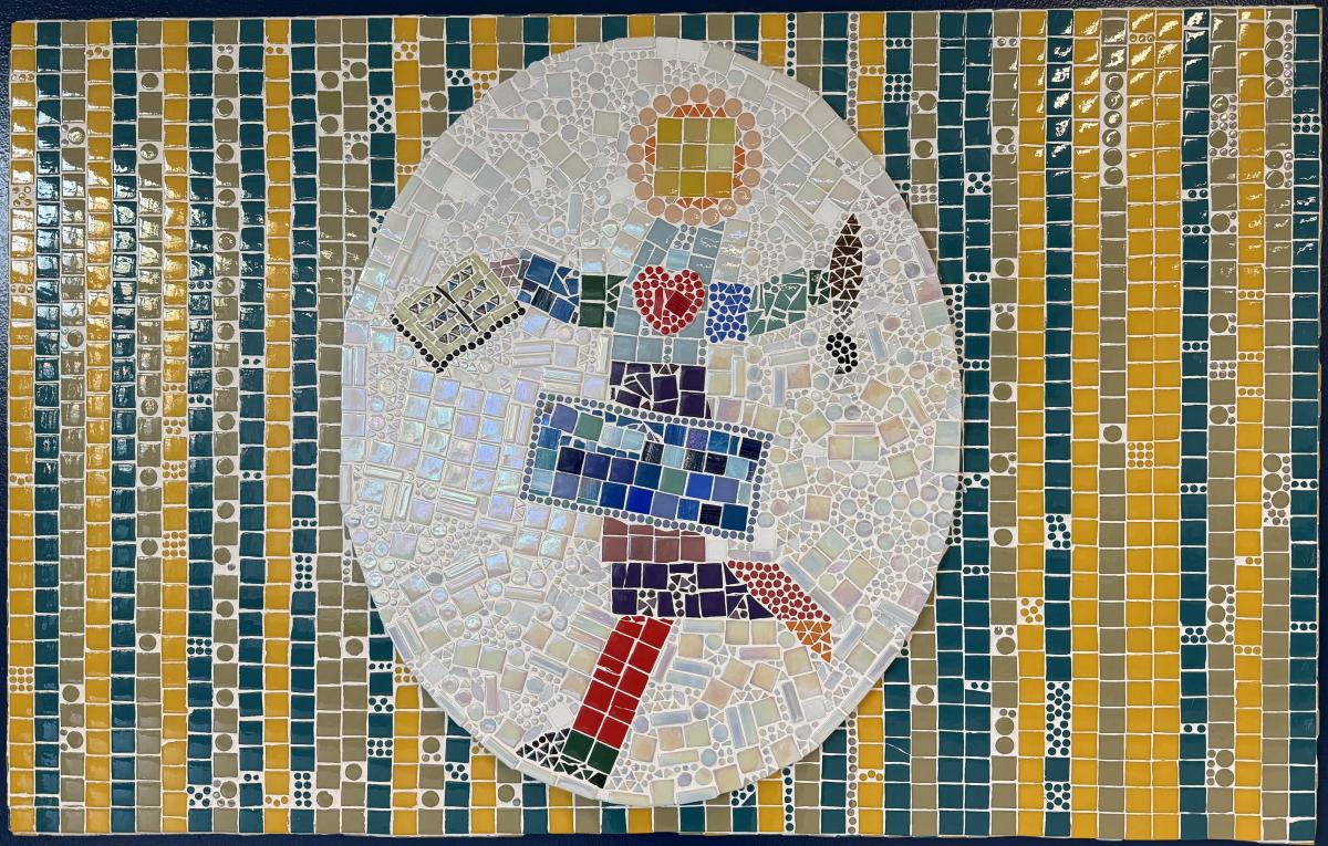 Colorful mosaic of a student with a paintbrush and book.