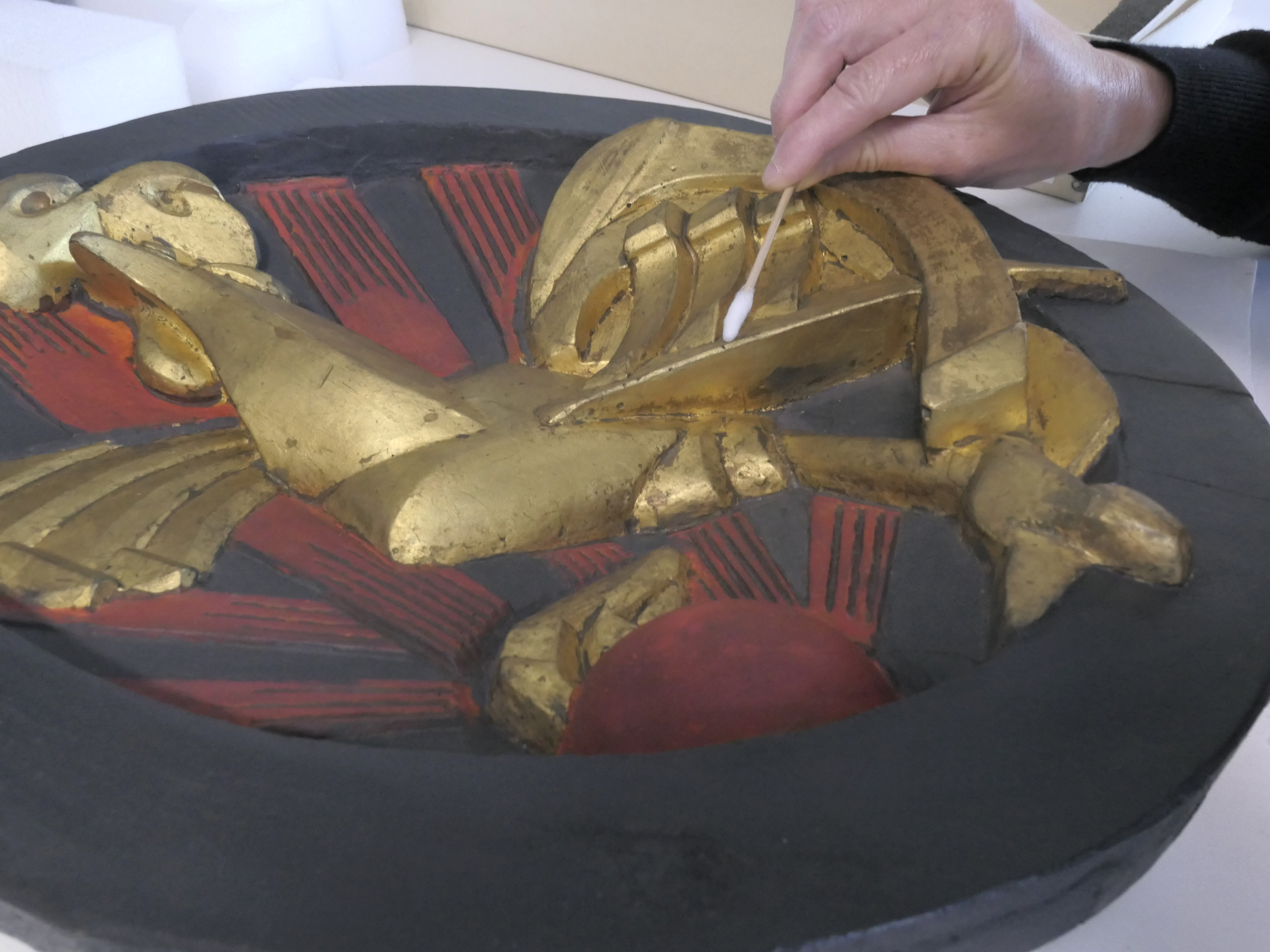 Photo of someone cleaning Gallic Cock by Raymond Duchamp Villon 