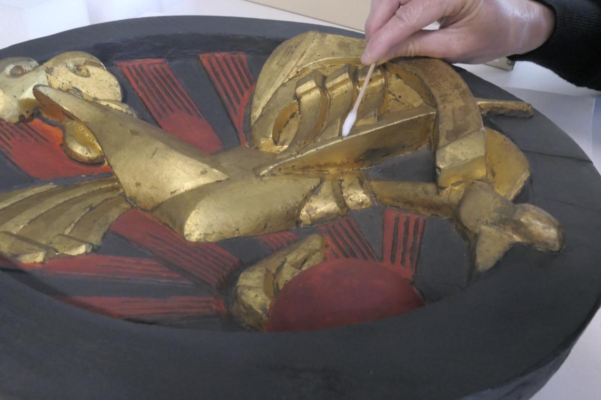 Photo of someone cleaning Gallic Cock by Raymond Duchamp Villon 